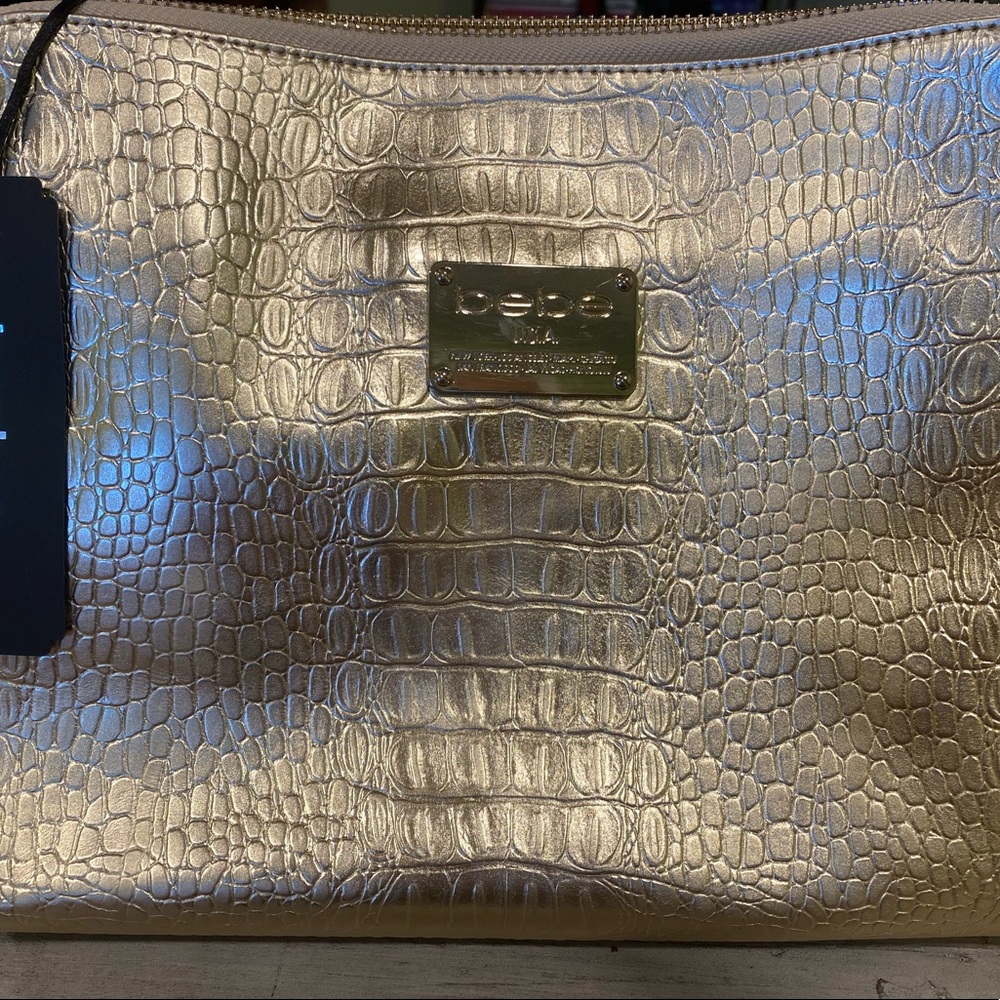 Bebe gold colored pocketbook!